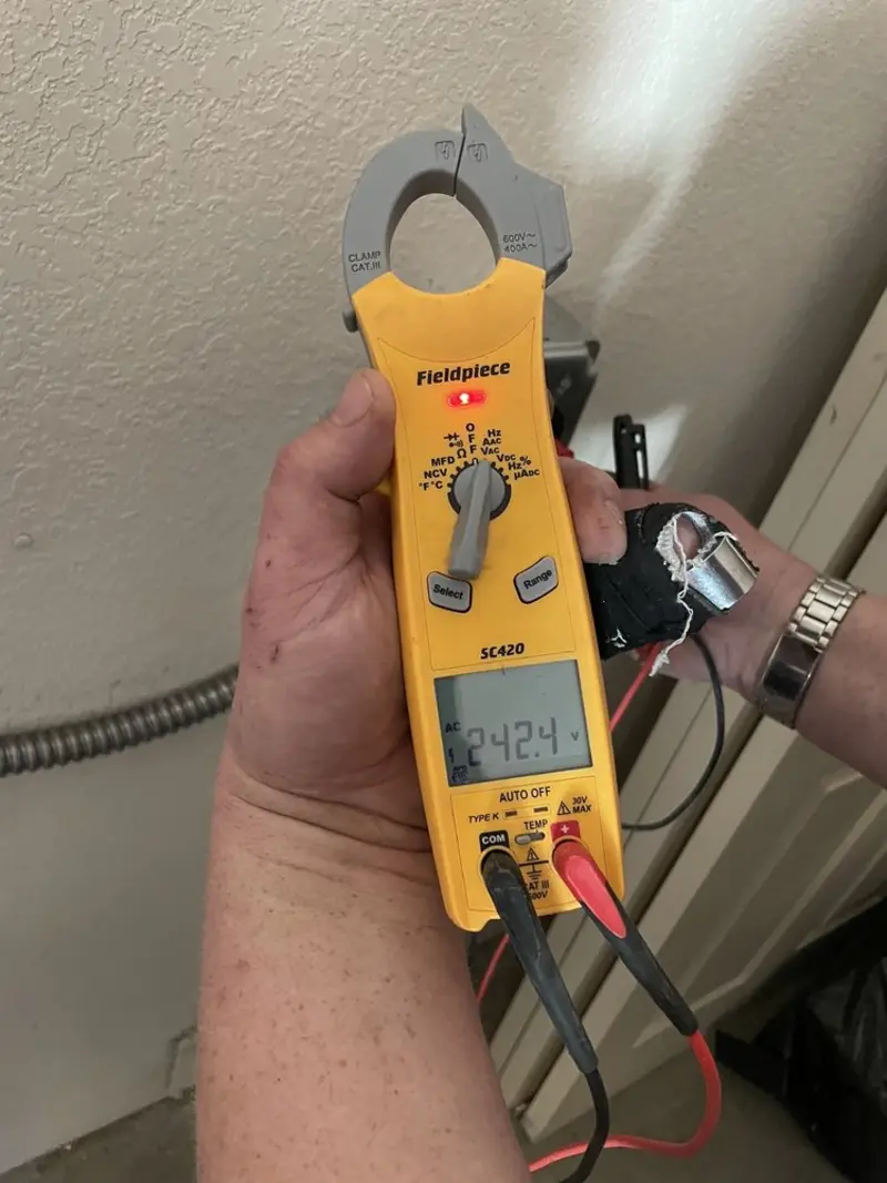 Voltage testing with clamp meter during Generator Installation in Kalkaska